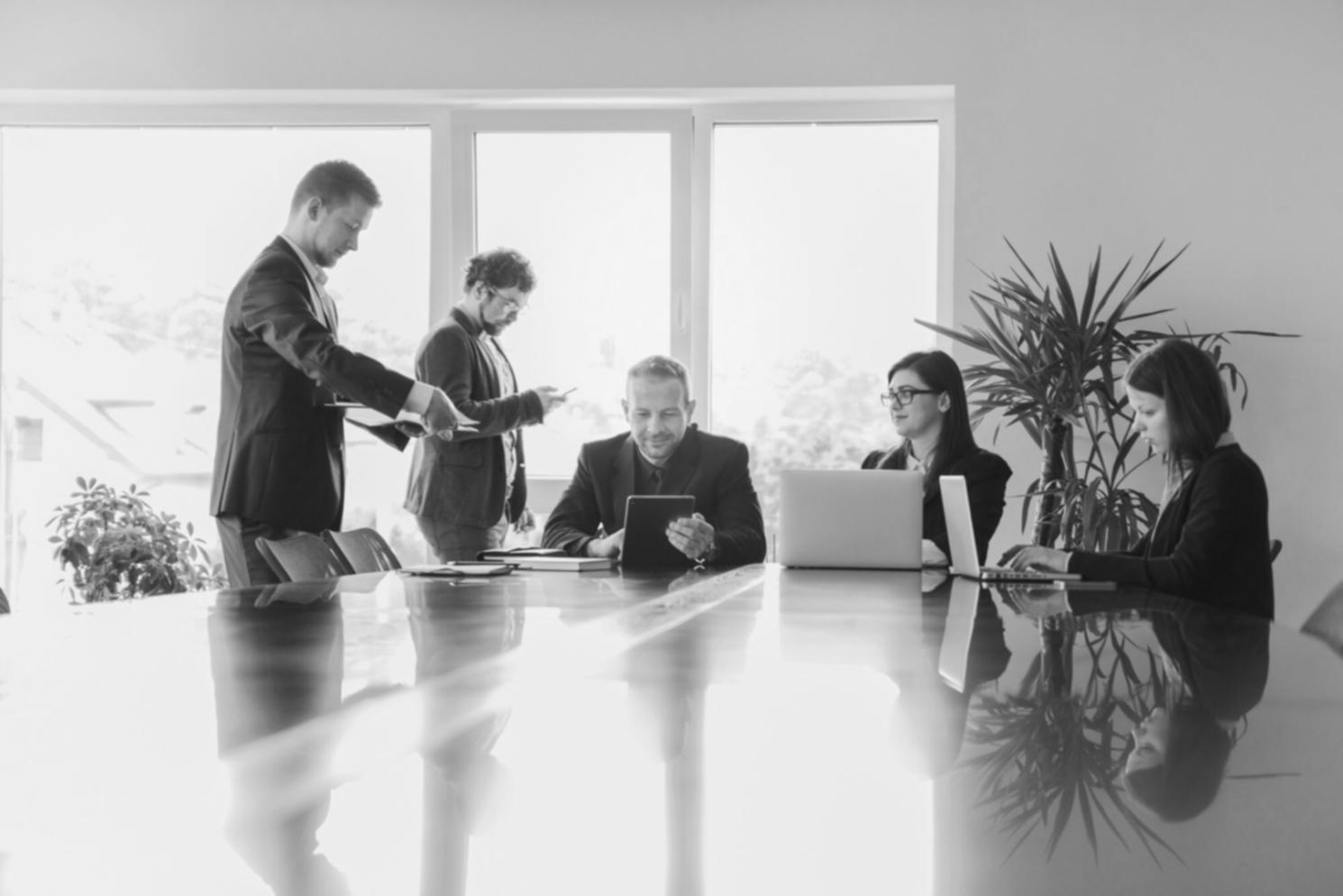 Successful business team celebrating financial milestone achievement